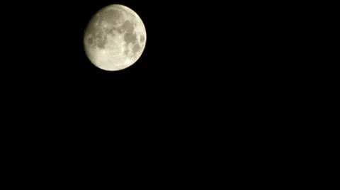 Moon floats through the sky on a black background time lapse Stock Footage 32578364