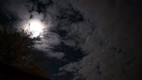 Moon get covered by dramatic clouds. Stockbeeldmateriaal 169257499