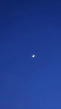 Moon glowing in sky Stock Photos