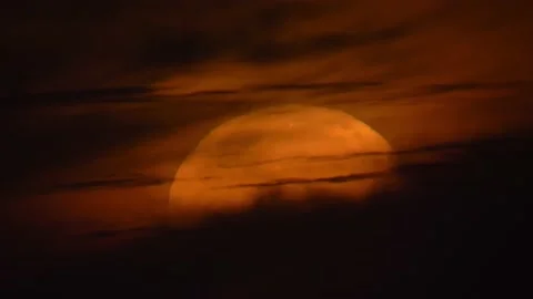 Moon goes behind clouds GT0771 Stock Footage 161507332