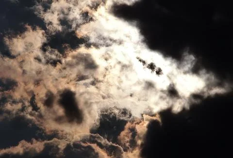 Moon hidden by clouds Stock Photos