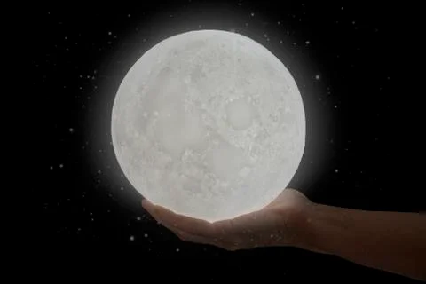 The moon hold by a human hand. Foto stock