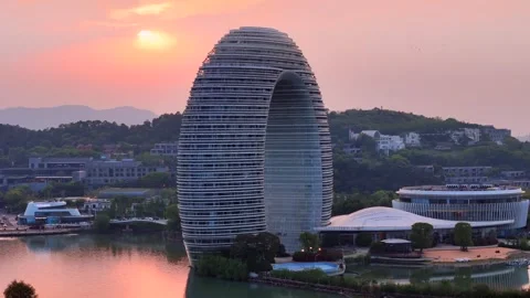 Moon Hotel Sunset: Iconic Architecture on Taihu Lake Stock Footage 331318533