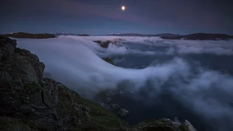 Moon with inversion flowing over the cliff Stock Footage 122962475