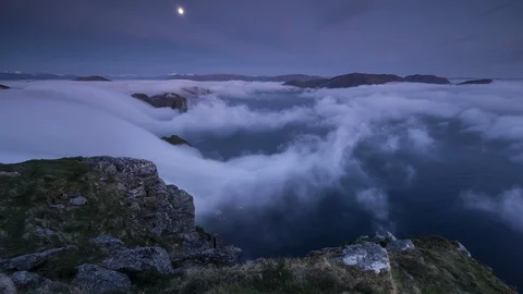 Moon with inversion flowing over the coastline Stock Footage 122961405