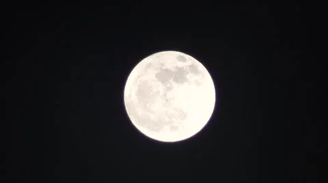 Moon With Light Clouds Traveling Past.m2ts Stock Footage 1099803