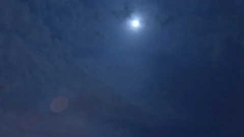 Moon light ray shining through white cloud on starry star blue sky Stock Footage 155299151