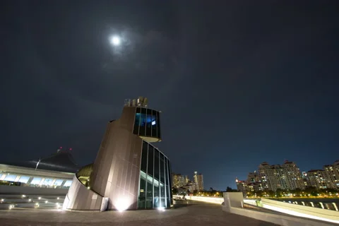Moon move above across tower at night singapore Stock Footage 145822427