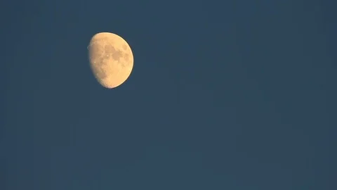 Moon movement in dark evening blue sky time-lapse - long shot Stock Footage 84758380