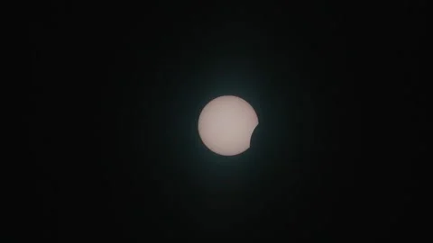 The moon moves across the sun during the eclipse, Madrid, ES - 12 Aug 2026 Stock Footage 342075375