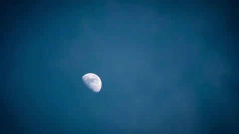 Moon moves on the sky behind the clouds Video stock 74359870
