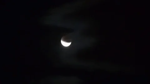 Moon moving on night sky during partial eclipse Stock Footage 113473502