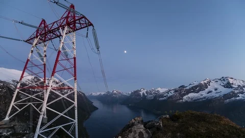 Moon moving over the high voltage power lines Stock Footage 122943957