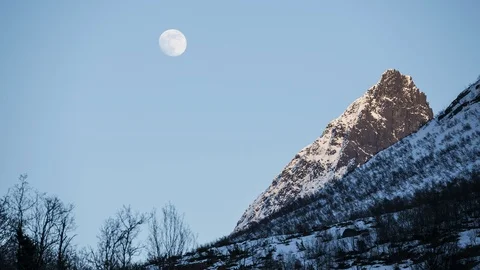 Moon moving over the mountain Stock Footage 122939607