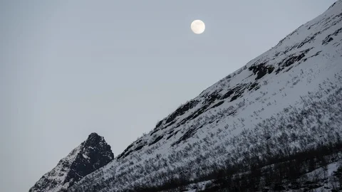 Moon moving over the mountain Stock Footage 122940483