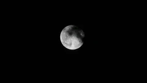 The moon at night and the dark clouds drifting from the moon's surface, the.. Stock Footage 247212151