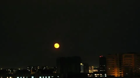 Moon in the night city Stock Footage 9834733