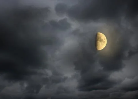 Moon in the night cloudy sky Stock Photos
