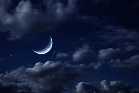 Moon in the night cloudy sky with stars Stock Photos