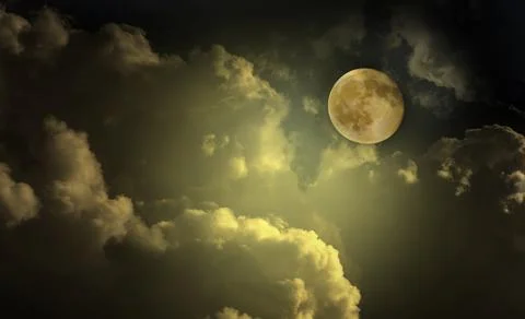 Moon in the night sky clouds Stock Photos