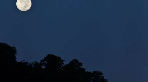 Moon. Night time moon falls behind the mountain time-lapse video Stock Footage 33893483