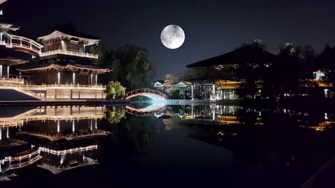 The moon over ancient buildings Stock Footage 251247066