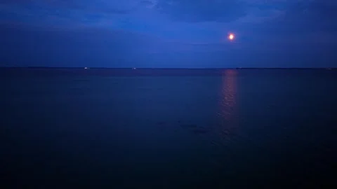 Moon over Baltic Sea at twilight Stock Footage 341489044