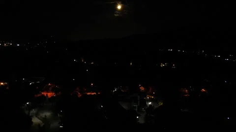 The moon over the city at night Stock Footage 317564912