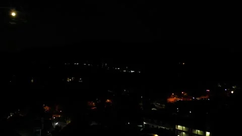 The moon over the city at night Stock-Footage 317564962