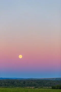 Moon over the field Stock Photos