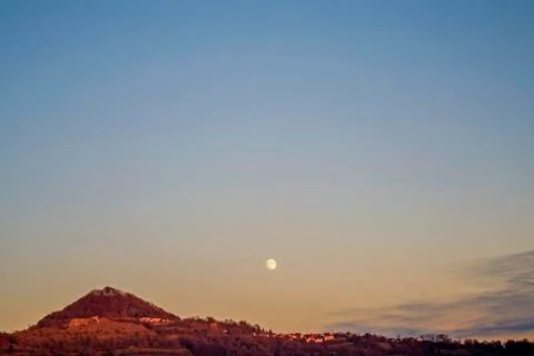 Moon over a hill Stock Photos