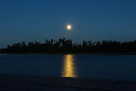 Moon over the lake Stock Photos