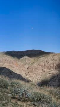 Moon over mountain with cloud shadow Foto stock
