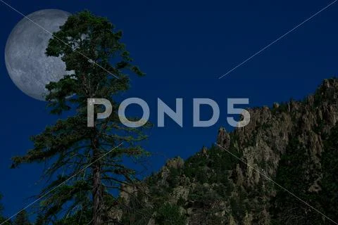 Moon over mountain Stock Photos