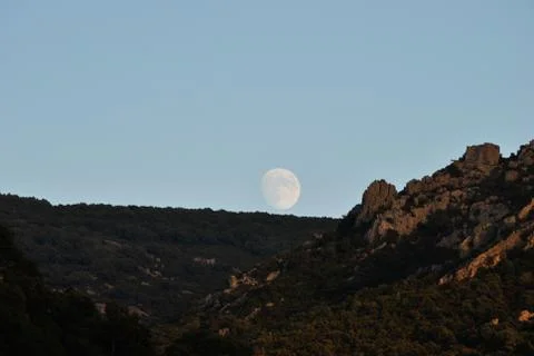 The moon over the mountains Stock Photos