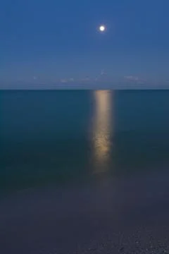 Moon over sea Stock Photos