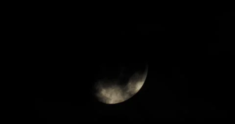 Moon partially obscured by clouds at night Stock Footage 265238614