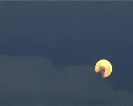 Moon passes behind clouds Stock Footage 134468