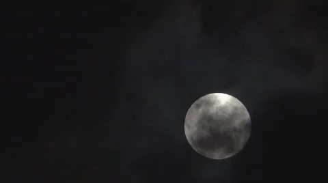 Moon passes through night clouds Stock Footage 44084534