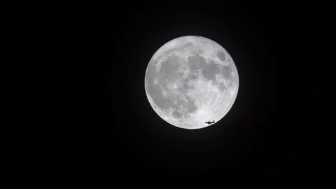 Moon with plane Stock Footage 131893907