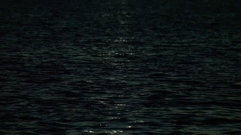 The moon reflecting in the ocean Stock Footage 74861985