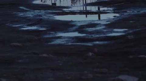 Moon reflecting in a puddle. Shot in slow motion Stock Footage 51113881