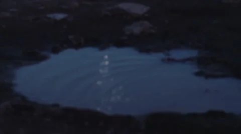 Moon reflecting in a puddle. Shot in slow motion Stock Footage 51113927