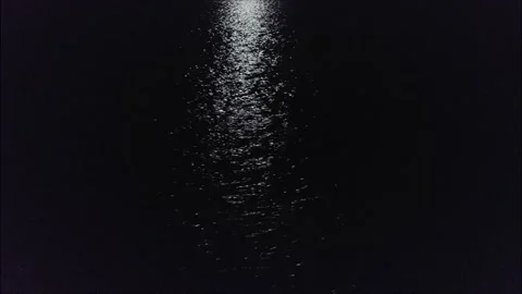 Moon reflection over water in the night Stock Footage