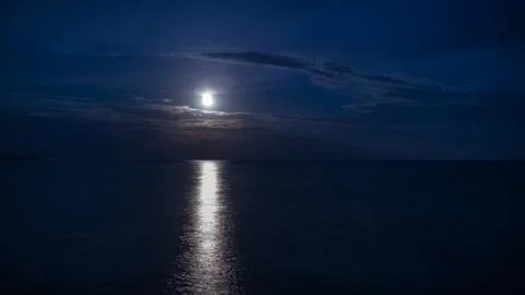 Moon reflection over water Stock Photos