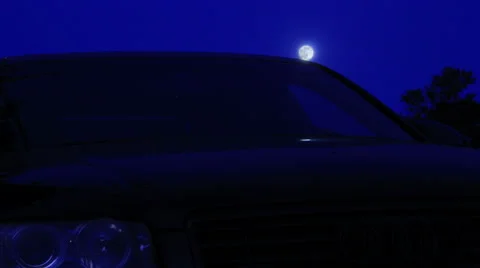 MOON RISES OVER BLACK CAR - TIME LAPSE Video stock 52591647