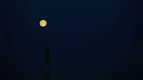 Moon rising on blue sky background Stock Footage 8654674