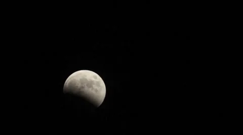 Moon rising in the dark sky Stock Footage 58954069