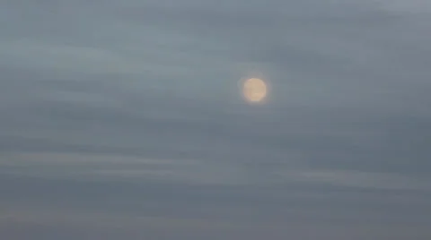 The moon is rising up in the evening sky Stock Footage 35326688