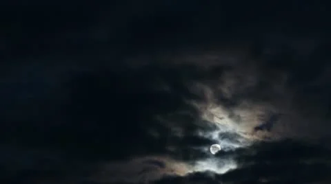 Moon rising  through clouds HD Stock Footage 21878188